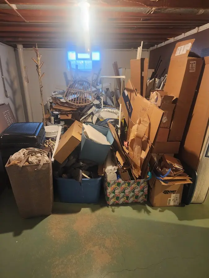 Roll-off dumpster container at job site for Yard Waste Dumpster Rental in Crockett